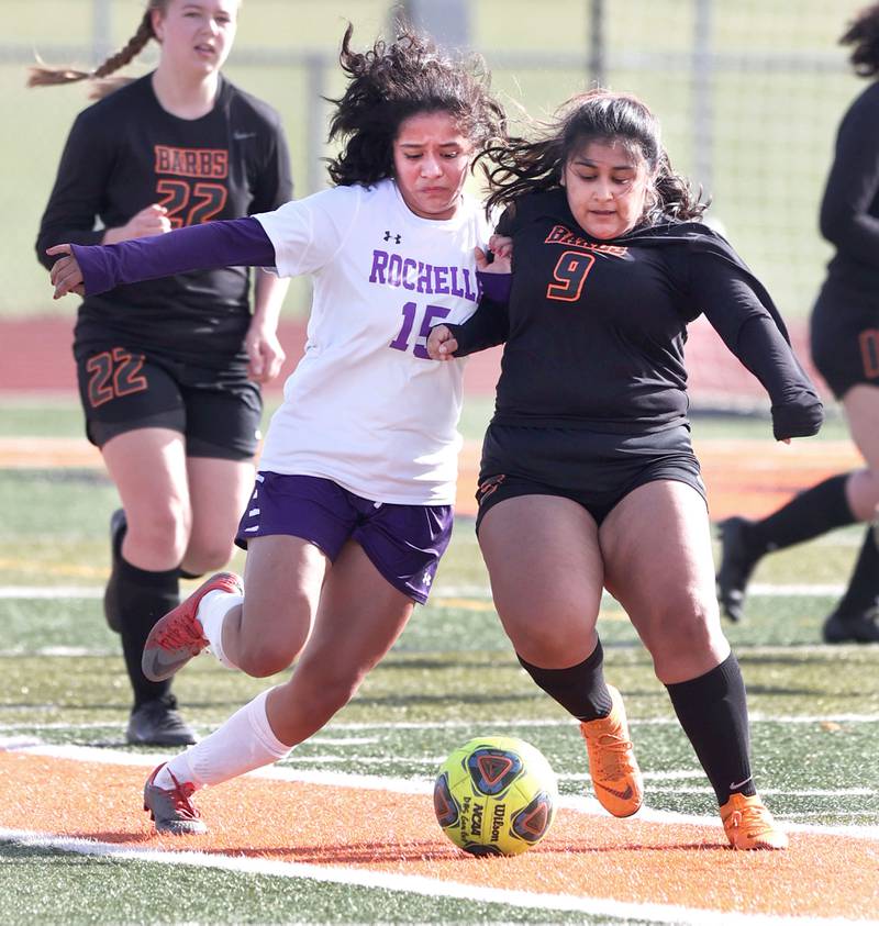 DeKalb's Diana Murrieta and Rochelle's Betty Flores fight for possession during their game Thursday, April 14, 2022, at DeKalb High School.