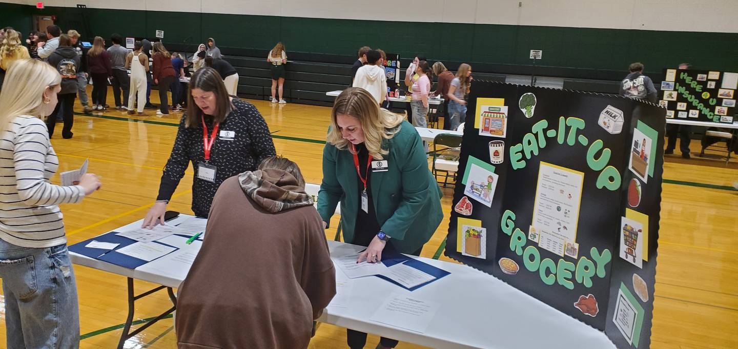Students use their allotted money to purchase groceries during the Grundy Area Vocational Center's "Welcome to the Real World" simulation on March 25 and 26.
