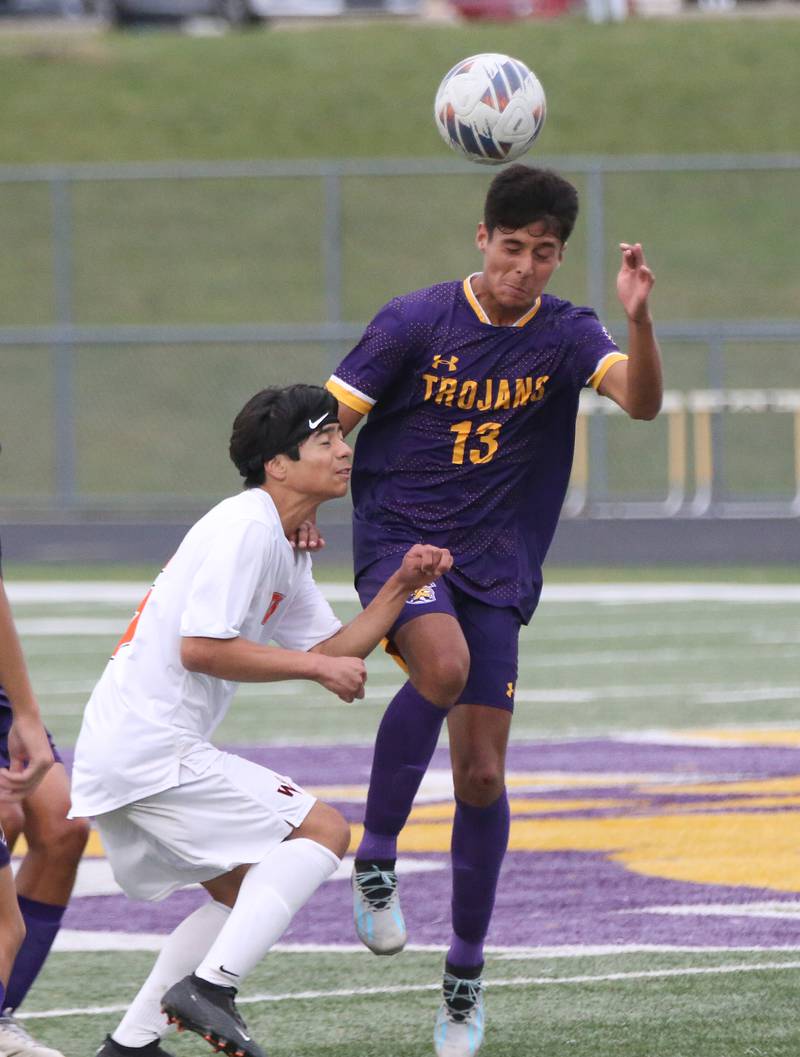 Mendota's Cameron Escatel puts a header on the ball over Winnebago's Agustin Gonzalez on Wednesday, Oct. 4, 2023 at Mendota High School.