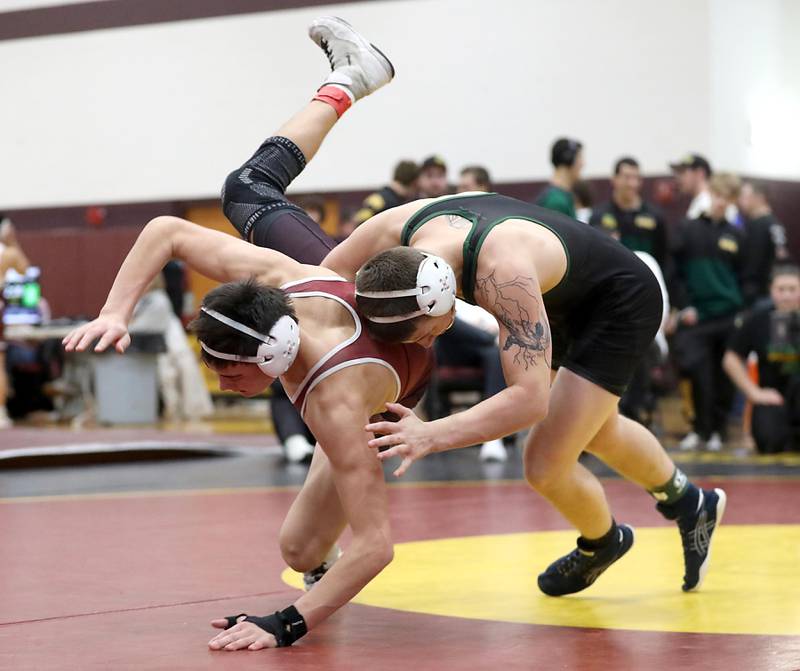 Crystal Lake South’s Nathan Randle takes down Marengo’s Mitchell Aukes during a138-pound match in the Tom DuBois Invite wrestling meet on Saturday, Dec. 13, 2025, at Richmond-Burton High School in Richmond.
