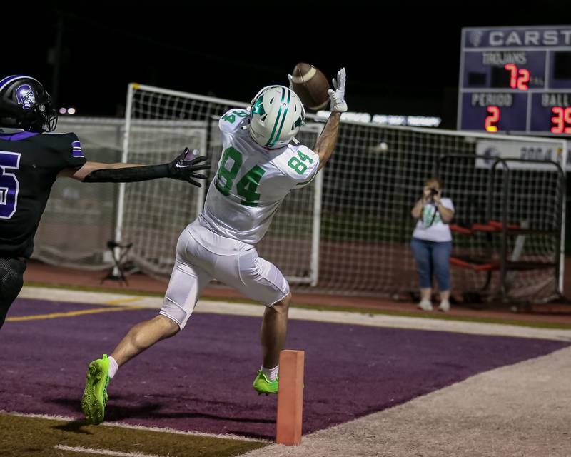 York's Luke Mallander (84) hauls in a touchdown catch during football game between York at Downers Grove North.  Sept 29, 2023.