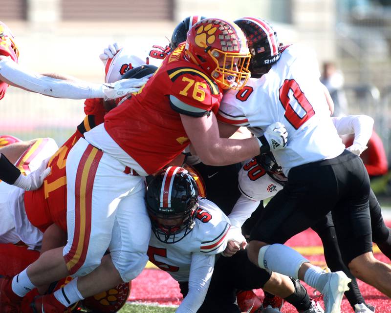 Batavia’s Brendan Conklin (left) goes up against Lincoln-Way Central’s Ryan Kotara during the Class 7A second round playoff game in Batavia on Saturday, Nov. 4, 2023.