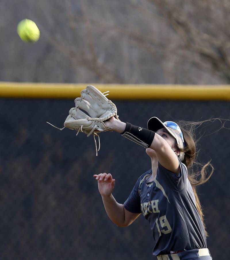 Grayslake North’s Madeline Von Allmen chases down a fly ball during a nonconference softball game against Prairie Ridge Thursday. March 23, 2023, at Grayslake North High School.