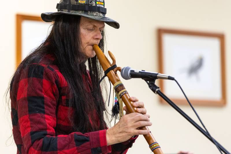 Jeff Redcrow of Woodstock performs a song on the flute during the Welcome Winter Celebration at the Lost Valley Visitor Center in Ringwood on Saturday, Dec. 28, 2024.