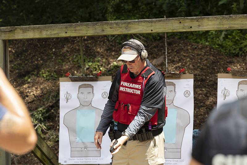 Range instructor Howard Malachi takes Sauk Valley Police Academy recruits through the steps of tactical reloading Wednesday, July 17, 2024, while on range in Dixon.