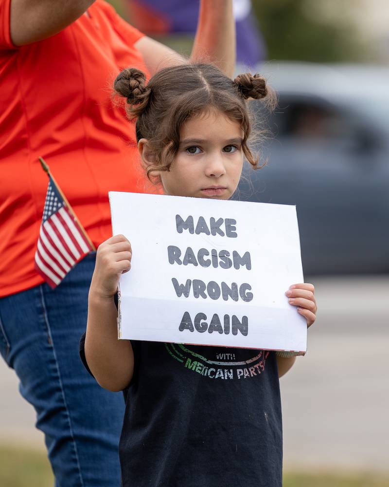 Child holds sign at the ‘No Kings 2.0’ Protest on Saturday, October 18, 2025 on North Division Street in Morris.