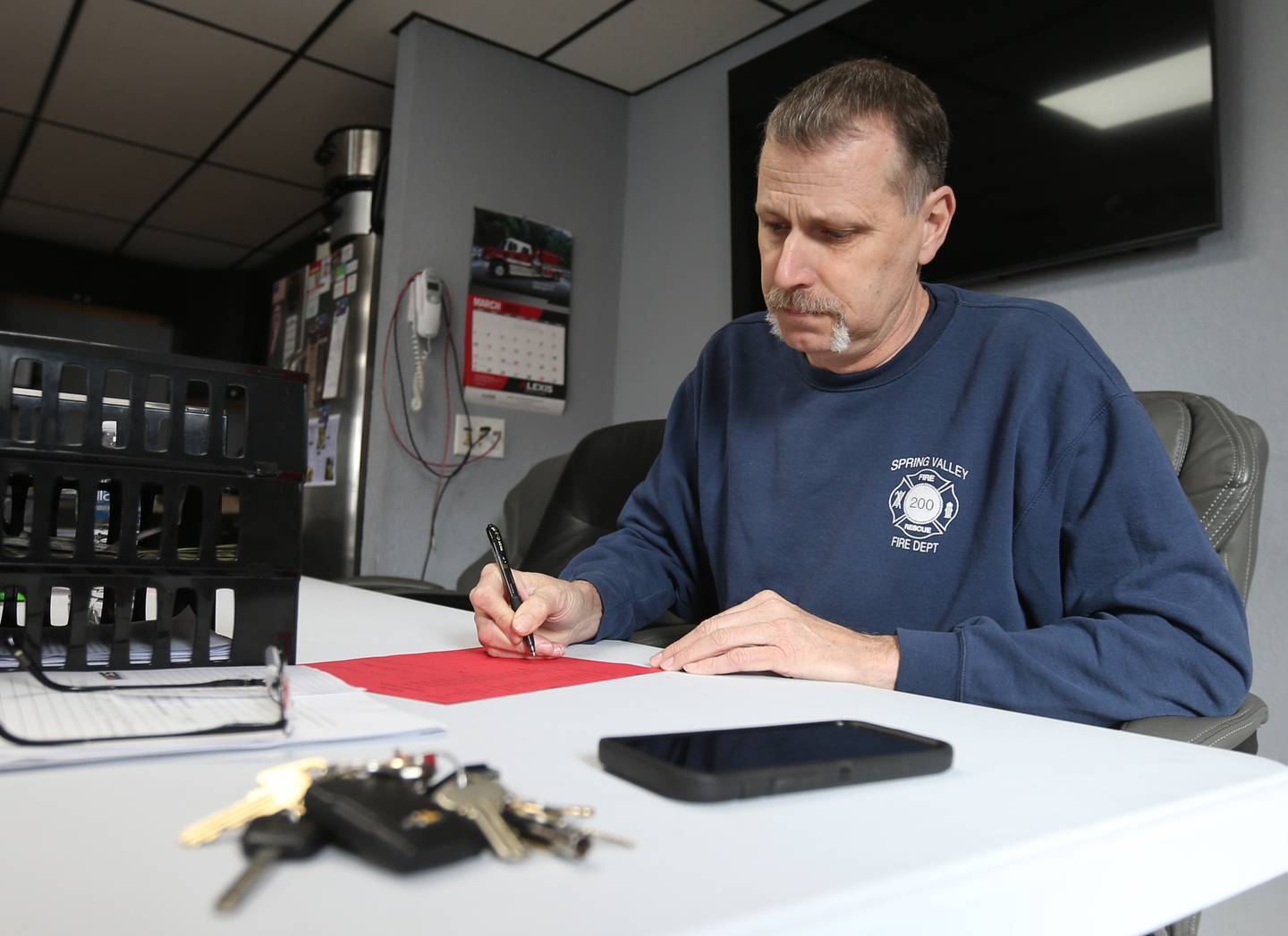 Spring Valley fire chief Todd Bogatitus works at his desk on Thursday, March 14, 2024 at the Spring Valley Fire Station.