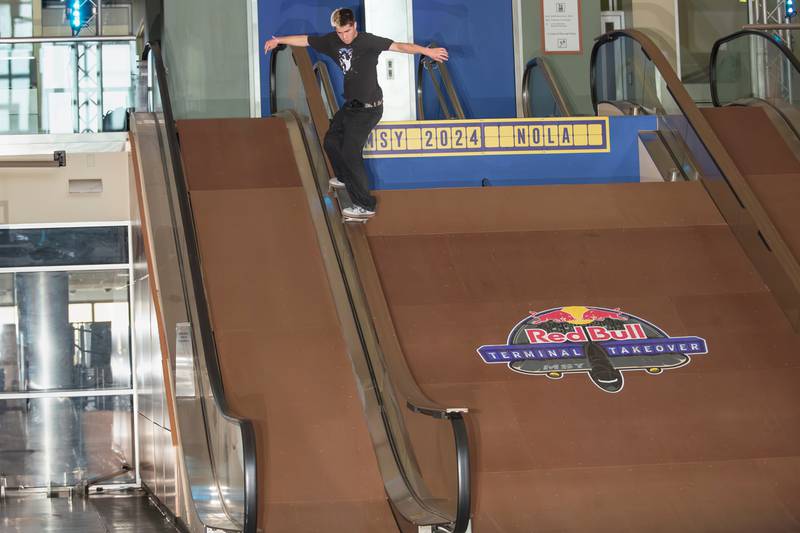 Gabe Schuch rides down an escalator at the 2024 Red Bull Boarding Pass competition in New Orleans.