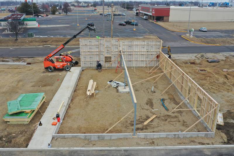 Crews use a lift to build exterior walls for the new Jersey Mike's Subs location on Thursday, Feb. 12, 2026 in Princeton. The business is located at the corner of Illinois Route 26 and Backbone Road.