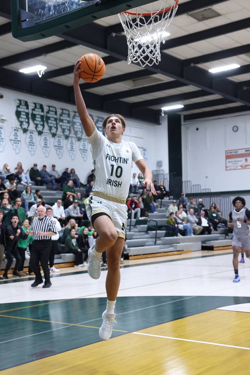 Bishop McNamara's Coen Demack hits a layup during the Fightin' Irish's 70-51 loss to Hope Academy on Tuesday, Dec. 9, 2025