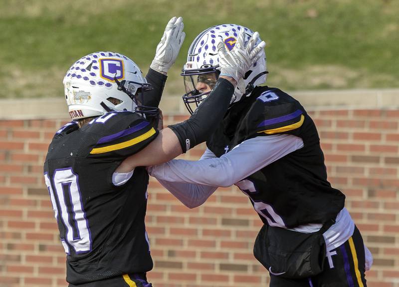Chicago Christian's Christian Flutman (right) celebrates his touchdown with teammate Kenny Jager Friday, Nov. 29, 2024, in the class 2A football state final against Maroa-Forsyth.