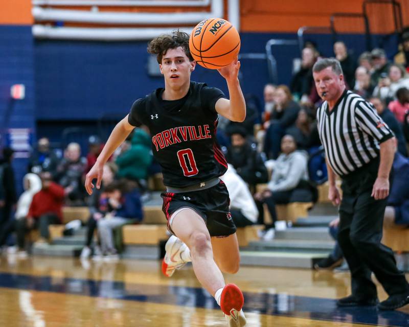 Yorkville's Gabe Sanders (0) tracks down the ball during their basketball game between Yorkville at Oswego, Tuesday Dec 10, 2024 in Oswego.