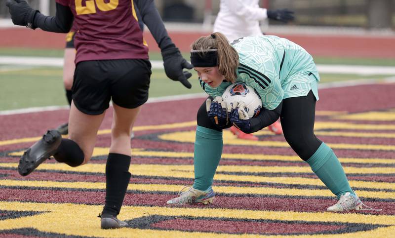 Crystal Lake South's keeper Maddie Zilm reels in a shot during girls soccer action Saturday, March 26, 2022 in Schaumburg.