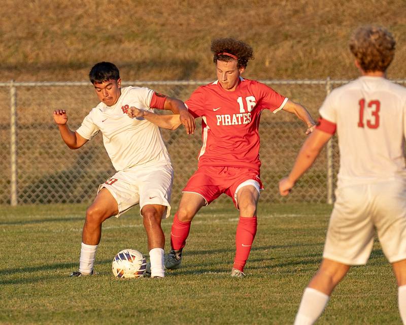 (from left) Ismael Mejia (10) of L-P maneuvers ball as Ian Fulkerson (16) of Ottawa attempts to steal on Wednesday, Sept. 17, 2025 at Ottawa High School in Ottawa.