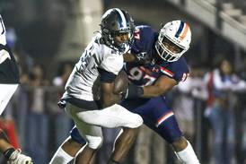 District 308 school officials cheering on Oswego High School football team