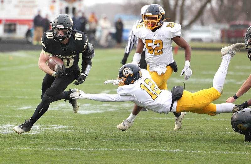 Sycamore's Zack Crawford avoids Sterling's Joseph Marchiorato as he carries the ball during their Class 5A state playoff game Saturday, Nov. 12, 2022, at Sycamore High School.