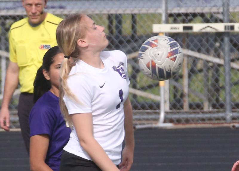 Dixon's Miki Worell knocks the ball down against Mendota on Wednesday, May 1, 2024 at Mendota High School.