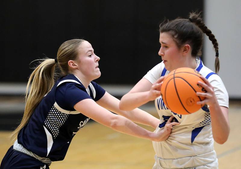 St. Viator's Kalin McCrea pressures Geneva's Keira McCann during the IHSA Class 3A Woodstock North Supersectional girls basketball game on Monday, March 2, 2026, at Woodstock North High School.