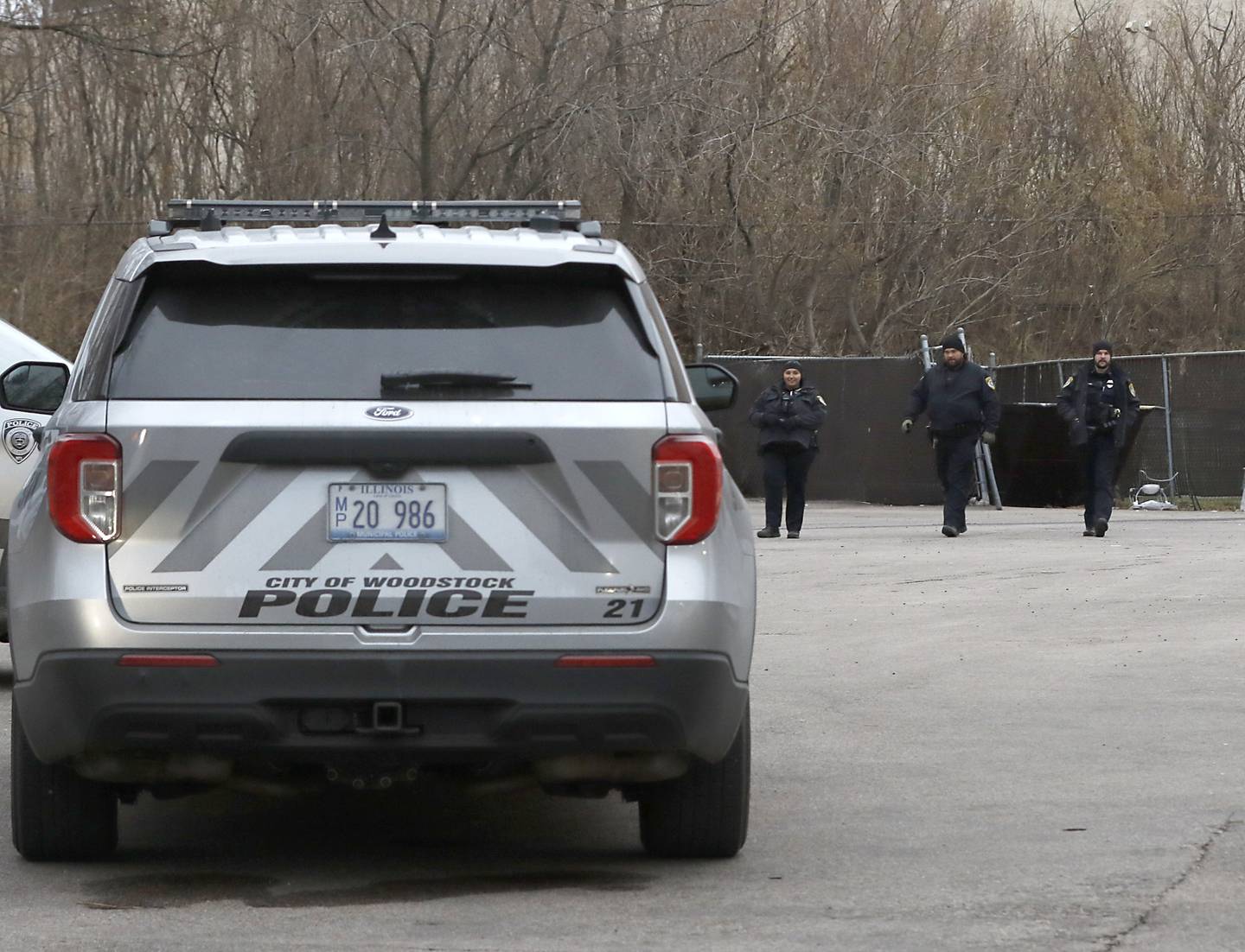 Woodstock police at the scene of a homeless camp behind the Woodstock Shell gas station, 110 N. Eastwood Drive, on Tuesday, Dec. 10, 2024. A man suffered a serious chest wound on Monday in the area.