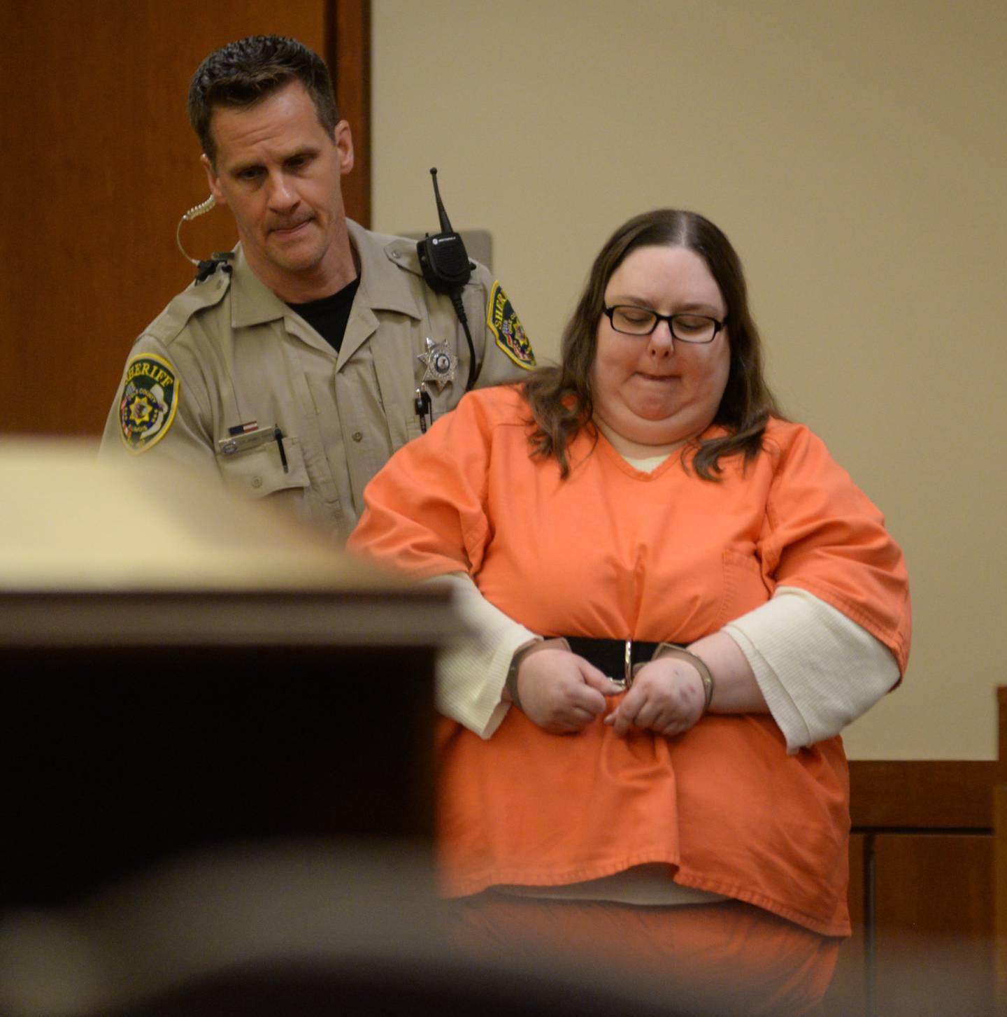 Sarah Safranek is escorted into an Ogle County courtroom by Ogle County Deputy Dan Daub on Thursday, May 18 for a motion hearing. She is charged with the murder of her 7-year-old son Nathaniel.