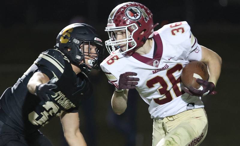 Morris' Jacob Swartz tries to get by Sycamore's Joseph Culotta during their game Friday, Oct. 21, 2022, at Sycamore High School.