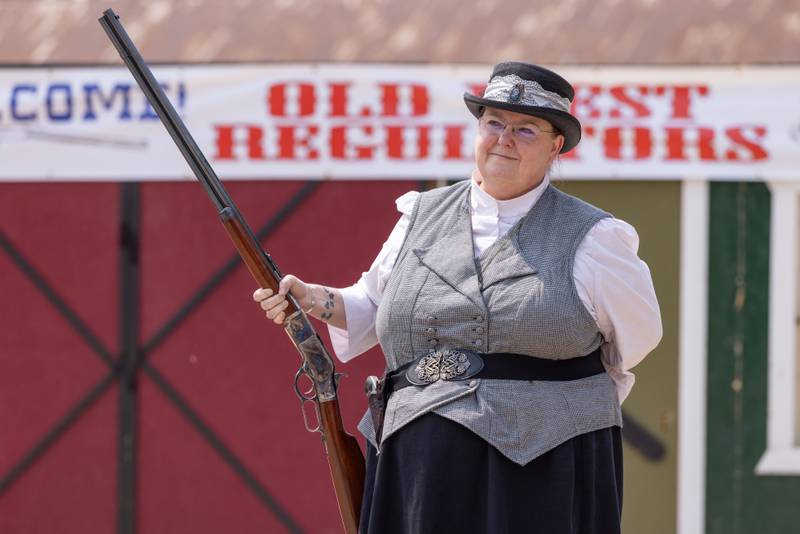 An actor with the Old West Regulators group looks on at the staged dual between cowboys during the reenactment of the life of Wild Bill Hickok behind the LaSalle County Historical Museum during Wild Bill Days on May 31, 2025 in Utica.