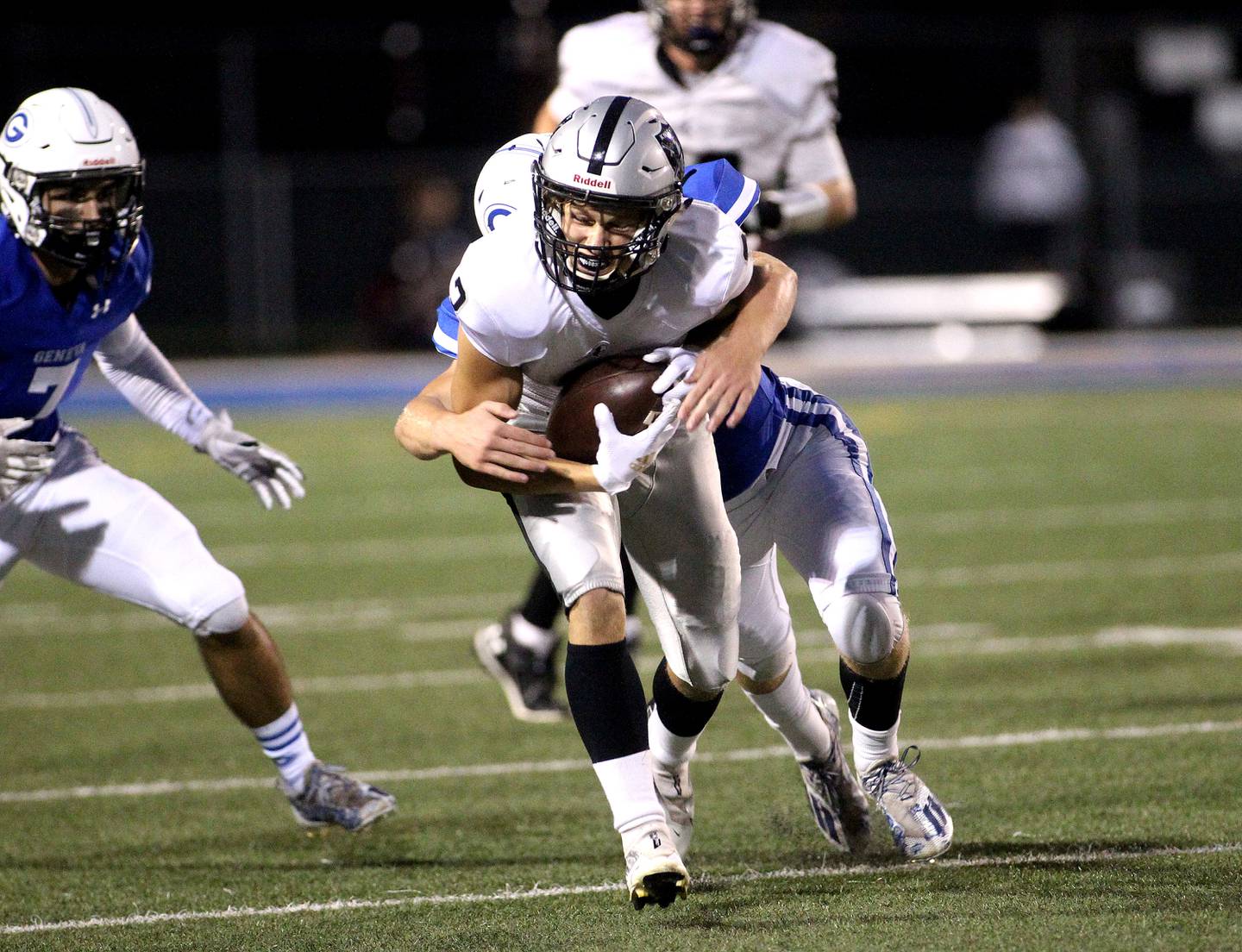 Kaneland's Sam Gagne carries the ball during a game at Geneva on Friday, Sept. 3, 2021.