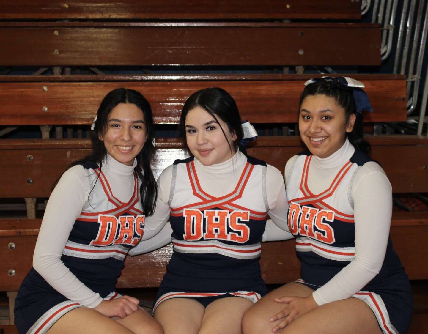 Cheerleaders for DePue this season include Emily Raya-Morales (from left), Janette Hernandez and Jasmine Rosales.