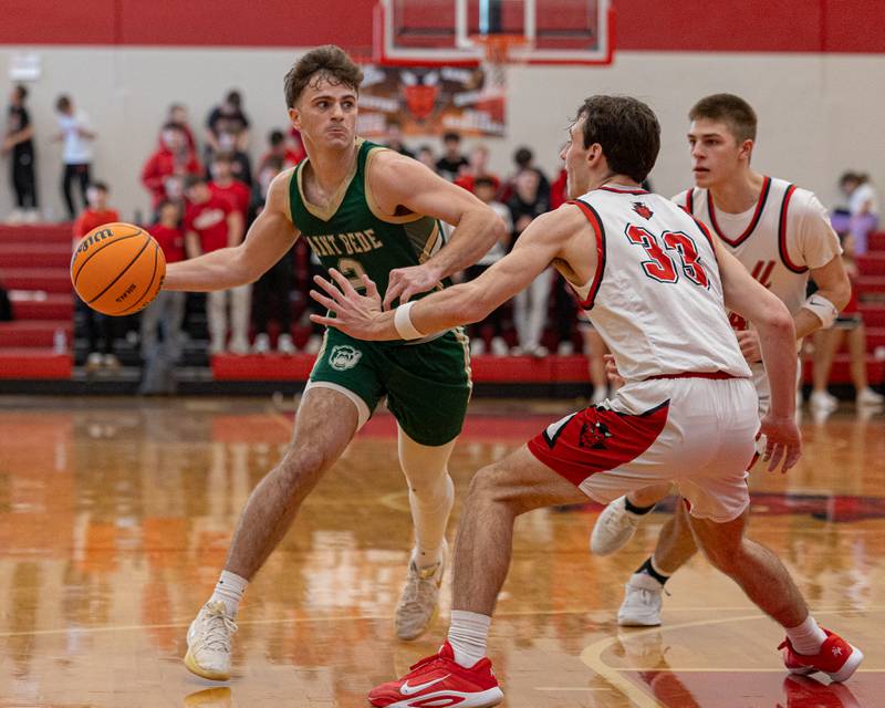 St. Bede's Gus Burr (2) looks to pass ball to teammate whilst being guarded by Braden Curran (33) of Hall on Saturday, January 31, 2026 at Hall High School in Spring Valley.