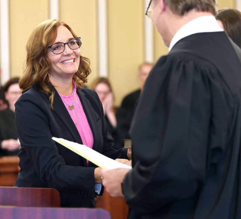 Judge Jill K. Konen shakes hands with 23rd Judicial Circuit Court Chief Judge Bradley Waller after being sworn in as an associate judge of the 23rd Judicial Circuit Friday, Sept. 23, 2022, at the DeKalb County Courthouse in Sycamore.
