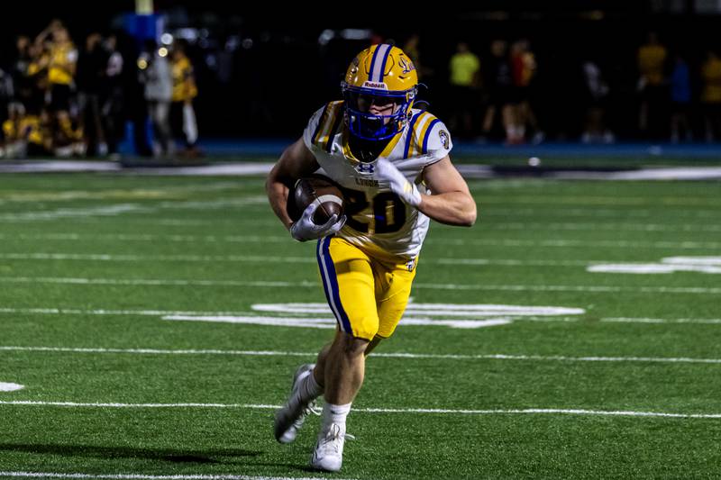 Lyons Township's EJ Kuhlman makes a move during a varsity football game against Joliet Catholic at Busey Bank Field at Joliet Memorial Stadium on Aug. 29, 2025.