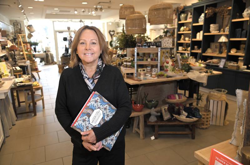 Fran Rouse poses in her Stonehouse Market business at 111 Town Square in Wheaton. She is opening another store in downtown Wheaton.