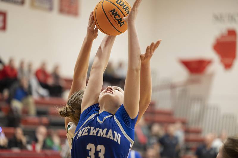 Newman’s Veronica Haley goes up for a rebound against River Ridge Thursday, Feb. 20, 2025, during the Class 1A girls basketball regional at Forreston.