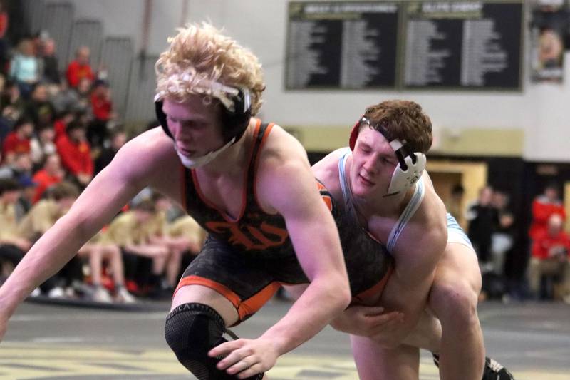 Marian’ Central's Dan French catches his Washington opponent in varsity boys wrestling on Thursday, Feb. 5, 2026, at Sycamore High School in Sycamore.