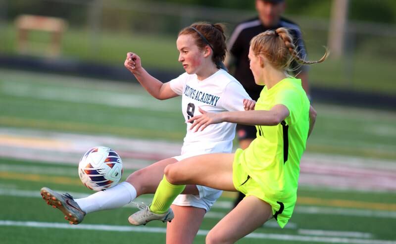 Richmond-Burton’s Margaret Slove, right, battles Willows’ Lucy James in Class 1A Sectional title soccer action at Richmond Friday night.