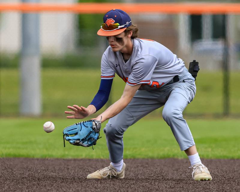 Oswego's Chase Gerwig (2) fields a grounder during the Class 4A Romeoville Sectional final game between Plainfield North at Oswego.  June 4, 2022.