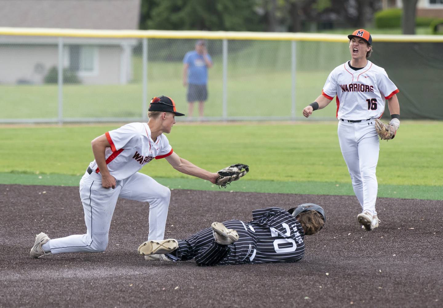 McHenry's Landon Clements tags Prairie Ridge's Connor Innis for the out at second base as McHenry's Kyle Maness cheers him on during their game on Friday, May 16, 2025 at McHenry High School. Ryan Rayburn for Shaw Local