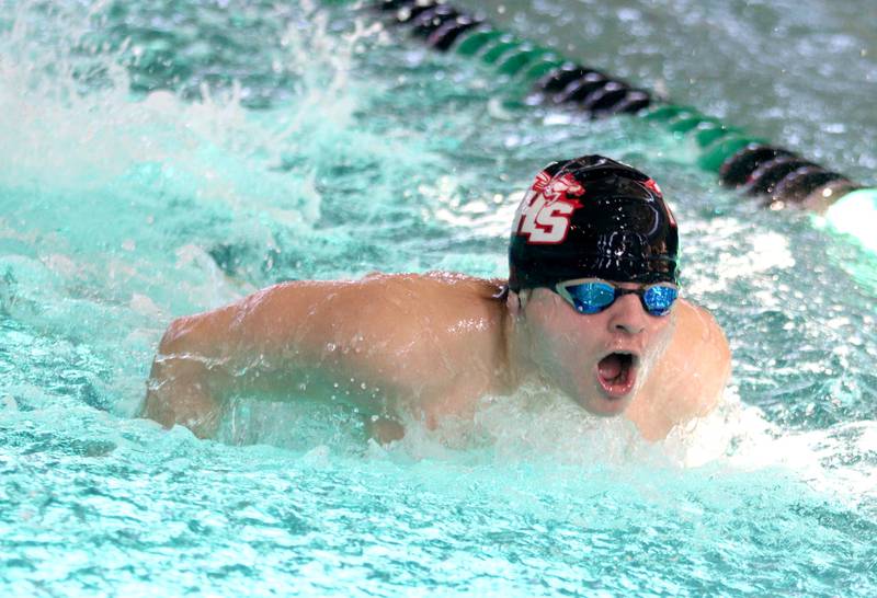 Huntley’s Szymon Osadnik competes in the 100-yard butterfly at the Fox Valley Conference Boys Swimming Invite at Woodstock North on Saturday.
