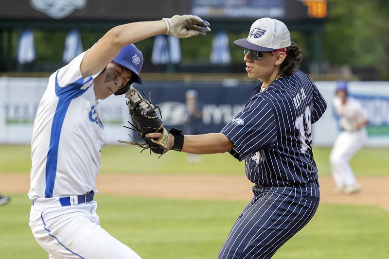 Newman’s Evan Bushman is tagged out by Chicago Hope’s Roberto Rey Jr. Monday, June 2, 2025, during the Class 2A Supersectional at Northwestern Medicine Field in Geneva.