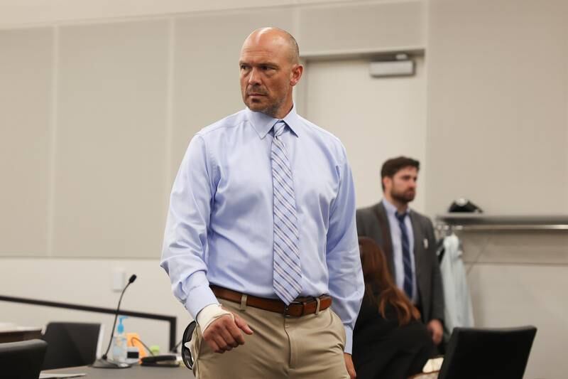 Edward Goewey leaves the courtroom after a pretrial meeting. Goewey, a Will County Deputy, is on trial for disorderly conduct after he allegedly yelled at school officials and threatened to personally remove a child believed to have made a threat to shoot students at St. Mary Catholic School in Modena. Tuesday, Aug. 9, 2022, in Joliet.