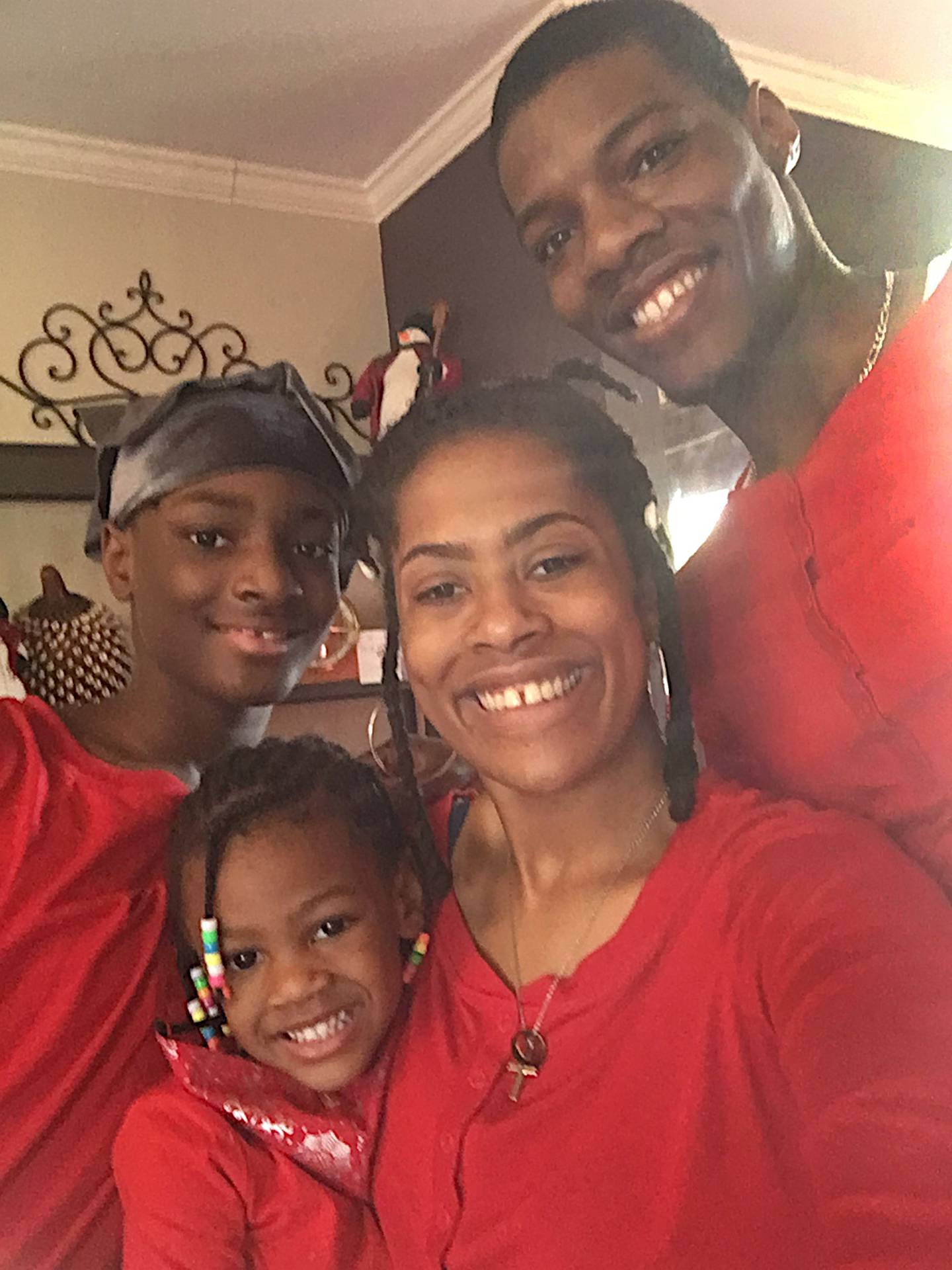 Daveyon Bradley of DeKalb poses for a photo with his family: his son Daveyon Bradley Jr., his wife Deborah and his daughter Dalilah.