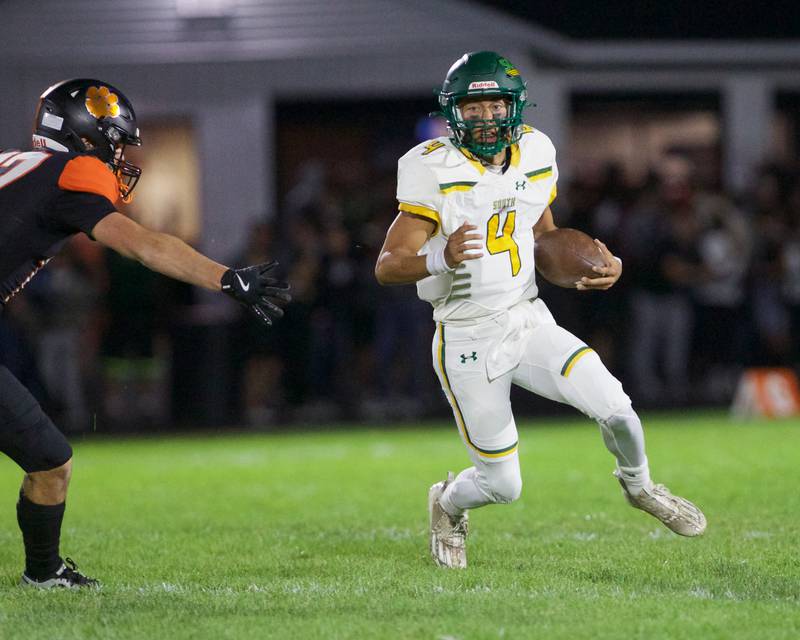 Crystal Lake South's Anthony Demirov looks to run for a gain against Crystal Lake Central on Friday, Sept. 27,2024 in Crystal Lake.