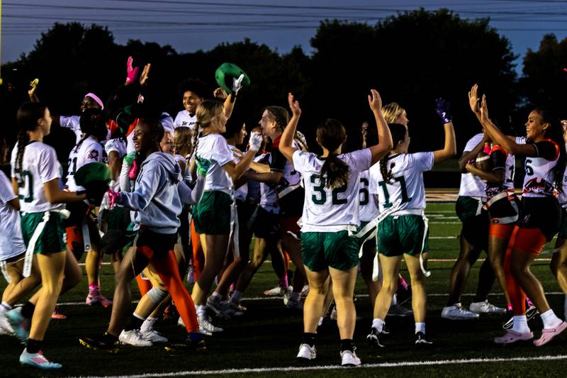 Plainfield Central celebrates with Bolingbrook, who took the field after them, after winning the varsity flag football Romeoville Regional semifinal game against Bradley-Bourbonnais at Romeoville on Oct. 7, 2025.