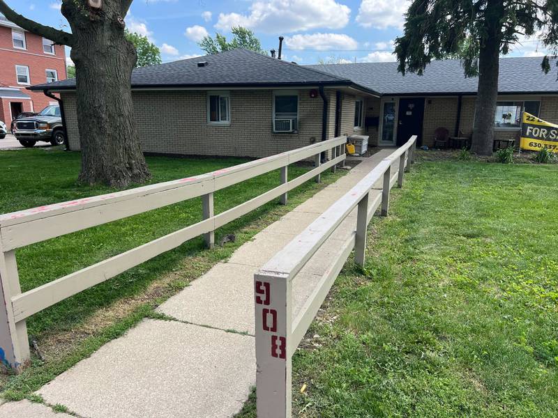 The walkway post of 908 Greenbrier Road, DeKalb, on Tuesday, June 17, 2025. A fire started in the early morning in a bathroom, leaving the building uninhabitable, injuring one person and displacing 16 residents, authorities said.
