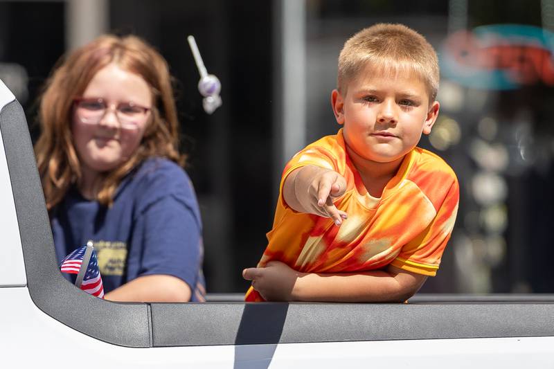 Charles Badger throws candy from truck on Sunday, Aug 31, 2025 at the Labor Day parade on Main Street in Streator.