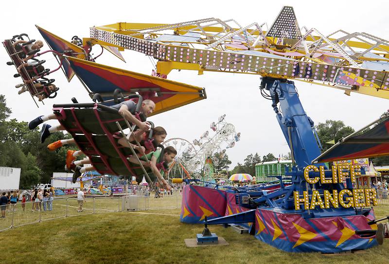 People ride the Cliff Hanger ride during Lakeside Festival Friday, June 30, 2023, at the Dole and Lakeside Arts Park in Crystal Lake.