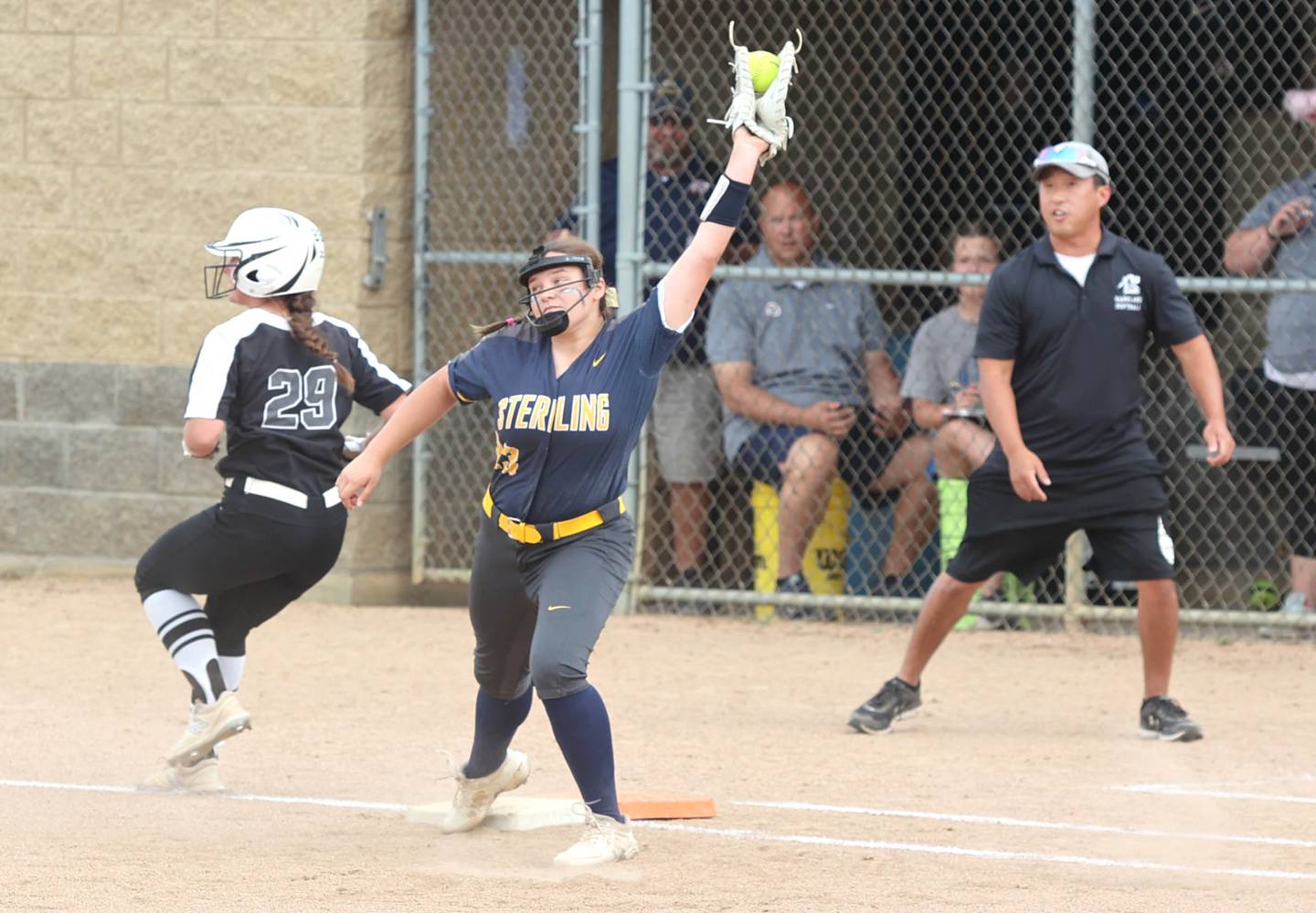 Kaneland's Olivia Stoker beats out an infield hit as Sterling's Sienna Stingley takes the throw Tuesday, May 31, 2022, during their Class 3A Sectional semifinal game at Sycamore High School.