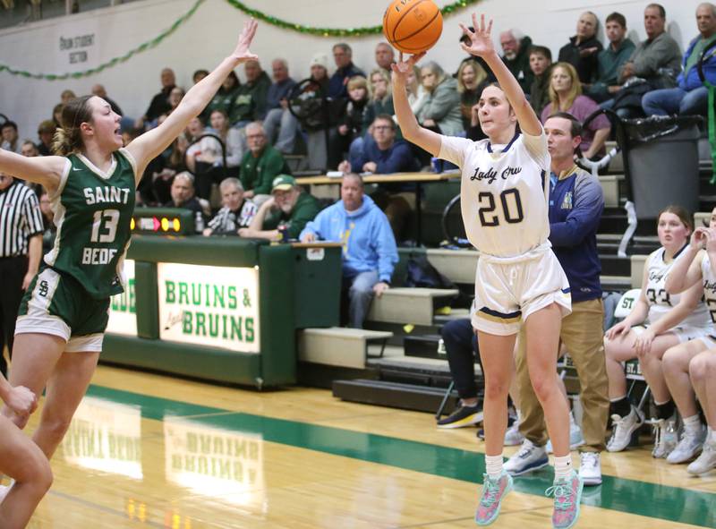 Marquette's Kaitlyn Davis drains a three-point basket on this shot over St. Bede's Ashlyn Ehm to take a 46-43 lead late in the fouth quarter during the Class 1A Regional semifinal game on Tuesday, Feb. 18, 2025 at St. Bede Academy.