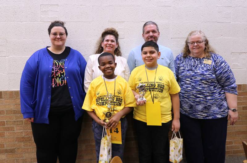 Lynne Thigpen Elementary School Assistant Principal Elizabeth Darlin, Joliet Public Schools District 86 Board of School Inspector Sandra Aguirre, T.E. Culbertson Elementary School Principal Larry Tucker and Superintendent Dr. Theresa Rouse congratulate First Place Winner Xavier Samuel and Second Place Winner David Gaucin.