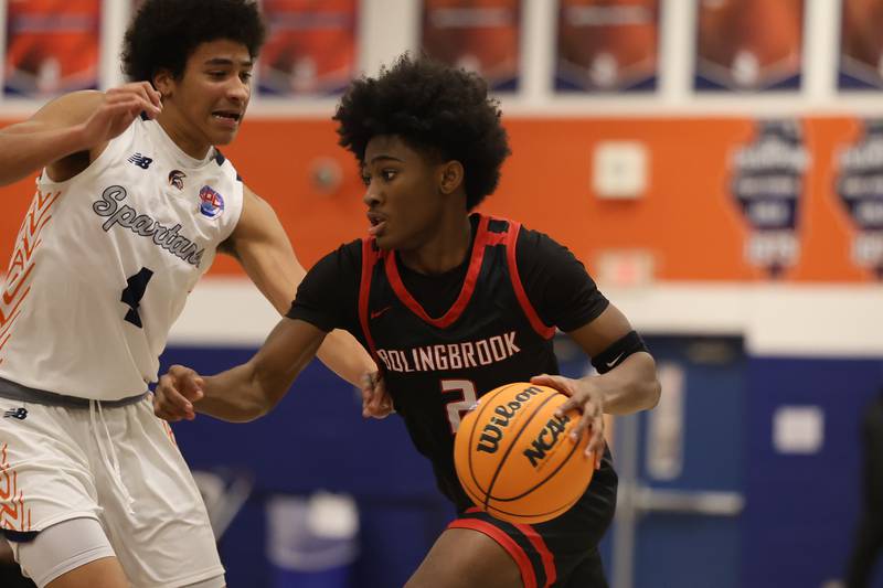 Bolingbrook's Mason Williams drives to the basket against Romeoville on Tuesday, Dec. 2, 2025 in Romeoville.